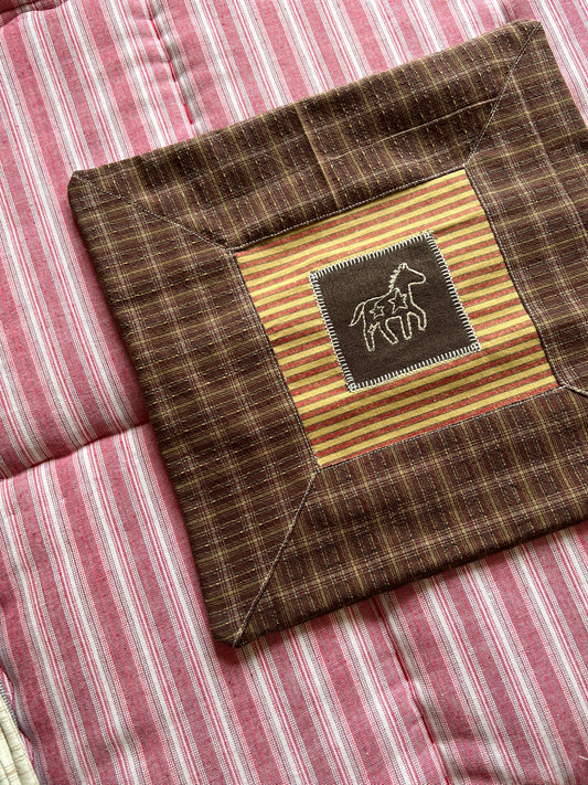 Cushion with embroidered motif