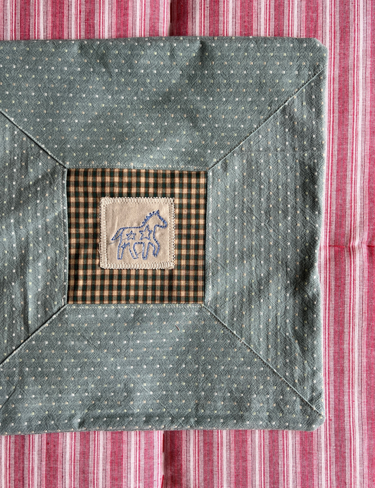 Cushion with embroidered motif