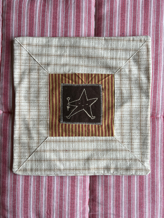 Cushion with embroidered motif
